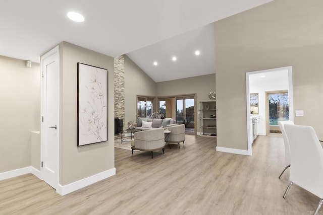 17636 Plaza Arica, San Diego, CA 92128 - living room featuring light wood-type flooring, baseboards, recessed lighting, and high vaulted ceiling