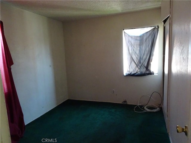 2032 Felberg Ave, Duarte, CA 91010 - spare room featuring dark colored carpet and a textured ceiling