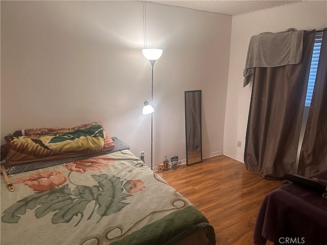 6339 Morse Ave Unit 202, North Hollywood, CA 91606 - bedroom with wood finished floors, a textured ceiling, and baseboards