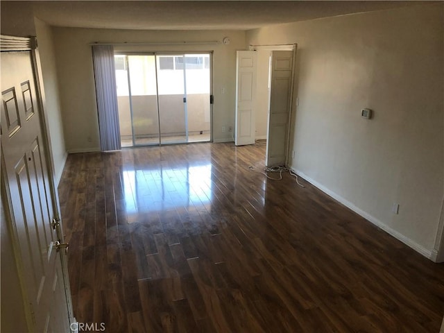 6339 Morse Ave Unit 202, North Hollywood, CA 91606 - spare room featuring baseboards and dark wood-style floors