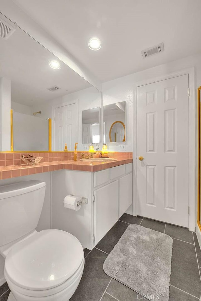 10707 Champagne Rd, Alta Loma, CA 91737 - full bathroom featuring vanity, recessed lighting, toilet, and tile patterned flooring