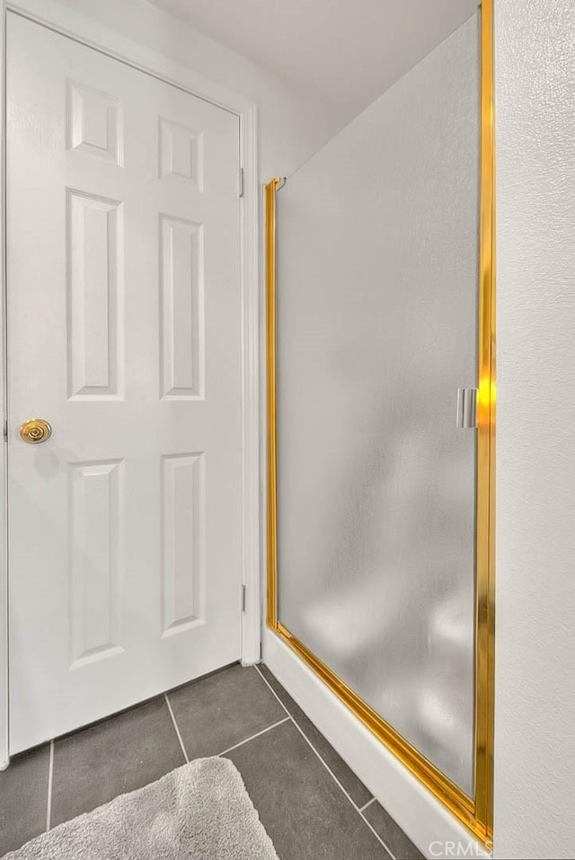 10707 Champagne Rd, Alta Loma, CA 91737 - bathroom featuring tile patterned flooring and a shower stall