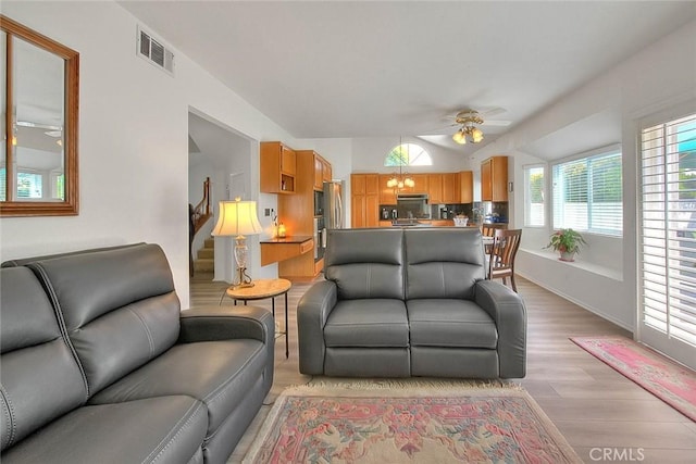 10707 Champagne Rd, Alta Loma, CA 91737 - living area featuring a ceiling fan, light wood finished floors, lofted ceiling, and stairs