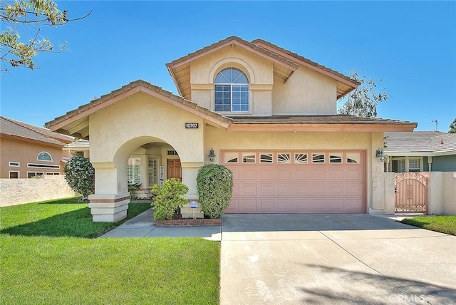 10707 Champagne Rd, Alta Loma, CA 91737 - view of front facade with stucco siding, concrete driveway, a gate, and an attached garage