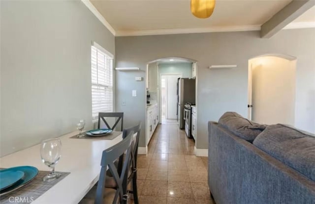 1390 Gundry Ave, Long Beach, CA 90813 - dining area featuring arched walkways, ornamental molding, and baseboards