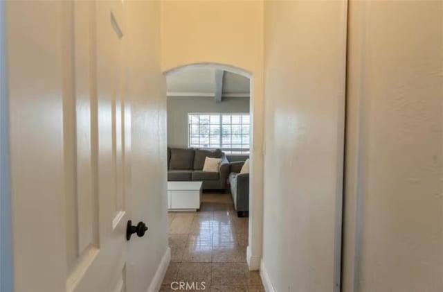 1390 Gundry Ave, Long Beach, CA 90813 - hallway with arched walkways, baseboards, tile patterned flooring, and ornamental molding