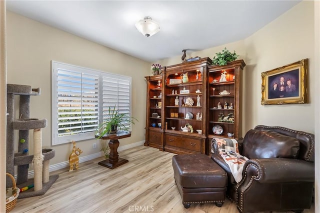 58598 Santa Maria Dr, Yucca Valley, CA 92284 - sitting room with wood finished floors and baseboards
