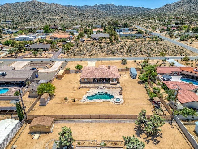 58598 Santa Maria Dr, Yucca Valley, CA 92284 - aerial perspective of suburban area featuring a pool and a mountainous background