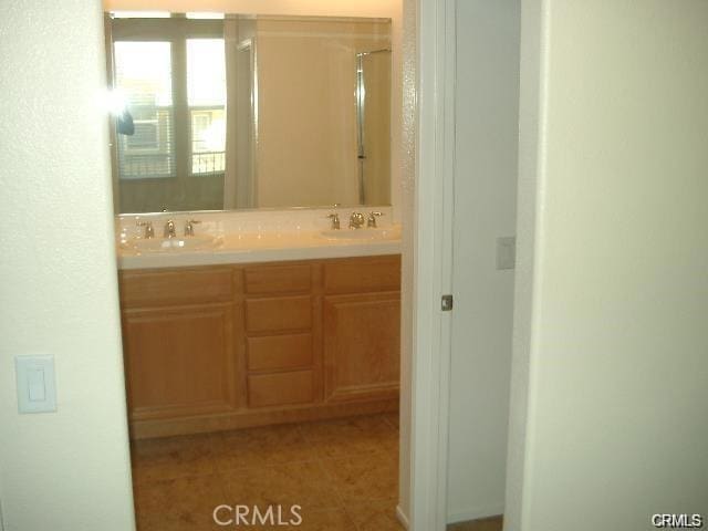 28266 Socorro St Unit 92, Murrieta, CA 92563 - full bathroom featuring double vanity, tile patterned flooring, and a shower