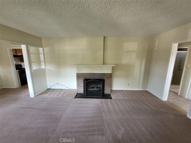 532 N Reese Pl, Burbank, CA 91506 - unfurnished living room with a fireplace with flush hearth, carpet flooring, a textured ceiling, and baseboards
