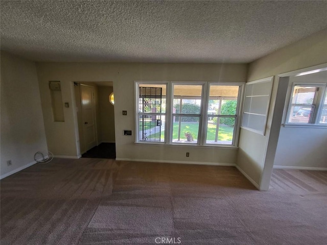 532 N Reese Pl, Burbank, CA 91506 - carpeted spare room featuring a textured ceiling and baseboards
