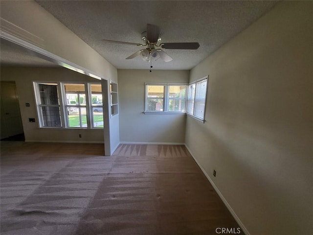 532 N Reese Pl, Burbank, CA 91506 - unfurnished room with a textured ceiling, baseboards, ceiling fan, and carpet flooring