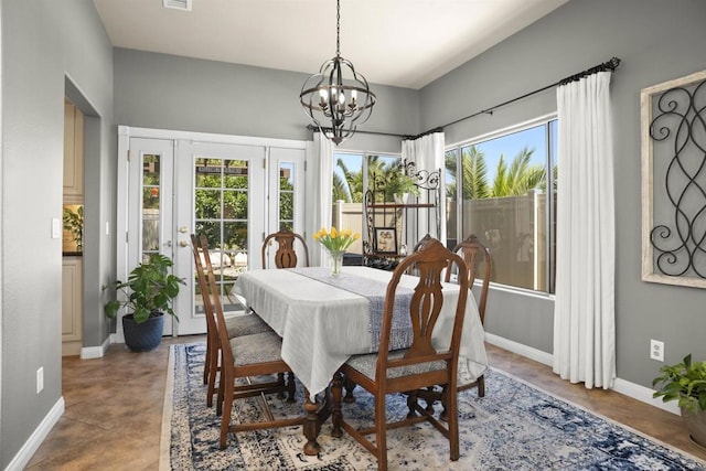 1990 Willowbrook Dr, Oceanside, CA 92056 - dining space featuring plenty of natural light, baseboards, a chandelier, and concrete floors