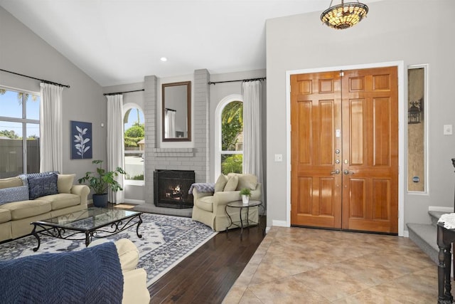 1990 Willowbrook Dr, Oceanside, CA 92056 - living area with healthy amount of natural light, a fireplace, light wood-style floors, and high vaulted ceiling