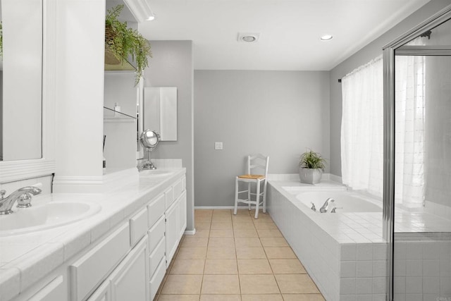 1990 Willowbrook Dr, Oceanside, CA 92056 - full bath featuring double vanity, a garden tub, tile patterned floors, baseboards, and recessed lighting