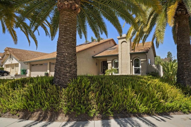 1990 Willowbrook Dr, Oceanside, CA 92056 - view of front of home with an attached garage and stucco siding
