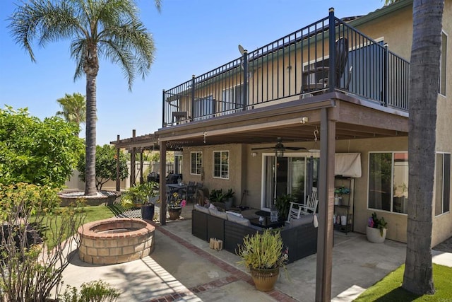 1990 Willowbrook Dr, Oceanside, CA 92056 - view of patio with a balcony, a ceiling fan, and an outdoor living space with a fire pit