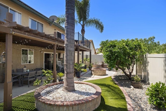 1990 Willowbrook Dr, Oceanside, CA 92056 - fenced backyard with a patio area, a balcony, and an outdoor fire pit