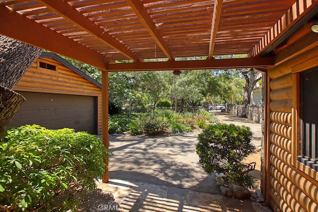 2057 Oakwood St, Pasadena, CA 91104 - view of patio with a garage, an outdoor structure, and a pergola