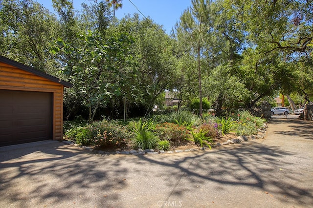 2057 Oakwood St, Pasadena, CA 91104 - view of side of property featuring driveway and a garage