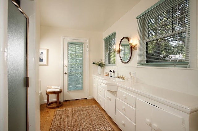 2057 Oakwood St, Pasadena, CA 91104 - bathroom featuring hardwood / wood-style flooring, vanity, and baseboards