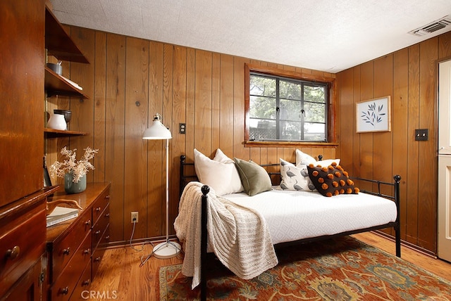 2057 Oakwood St, Pasadena, CA 91104 - bedroom featuring light wood-style flooring and wood walls