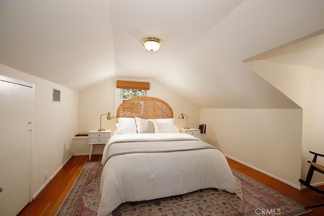 2057 Oakwood St, Pasadena, CA 91104 - bedroom featuring wood finished floors, vaulted ceiling, and baseboards