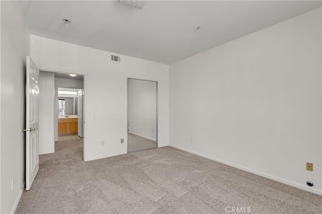 375 Central Ave Unit 173, Riverside, CA 92507 - unfurnished bedroom featuring light colored carpet and baseboards