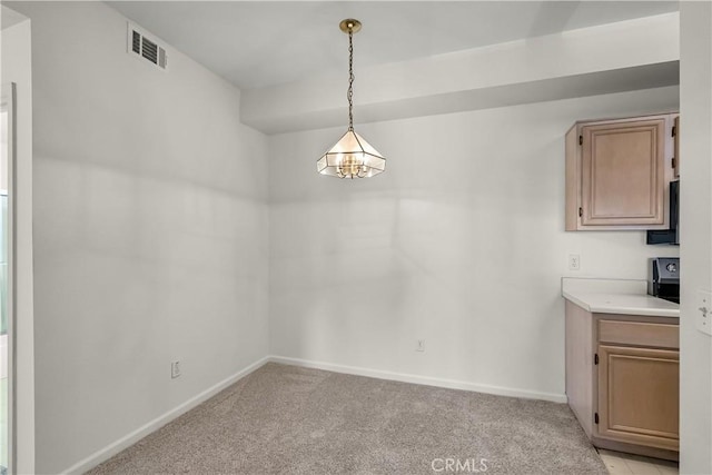 375 Central Ave Unit 173, Riverside, CA 92507 - unfurnished dining area featuring light carpet and baseboards
