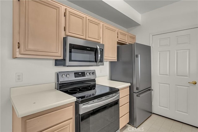 375 Central Ave Unit 173, Riverside, CA 92507 - kitchen featuring stainless steel appliances, light brown cabinetry, light countertops, and light tile patterned flooring