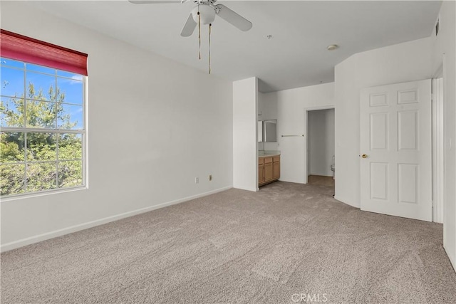 375 Central Ave Unit 173, Riverside, CA 92507 - unfurnished bedroom featuring multiple windows, light carpet, baseboards, and ceiling fan