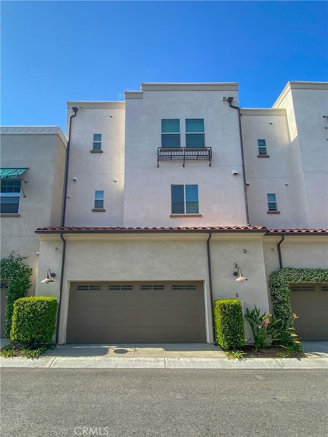 5 Abarrota St, Rancho Mission Viejo, CA 92694 - back of property featuring an attached garage and stucco siding