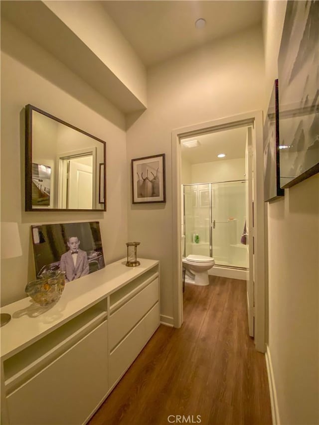 5 Abarrota St, Rancho Mission Viejo, CA 92694 - full bath featuring a shower with door, toilet, wood finished floors, vanity, and baseboards