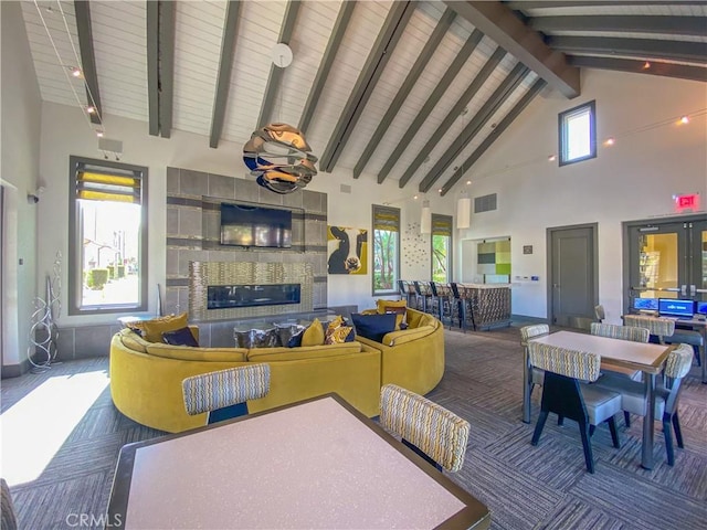 5 Abarrota St, Rancho Mission Viejo, CA 92694 - living area featuring a fireplace, high vaulted ceiling, and wood ceiling with exposed beams