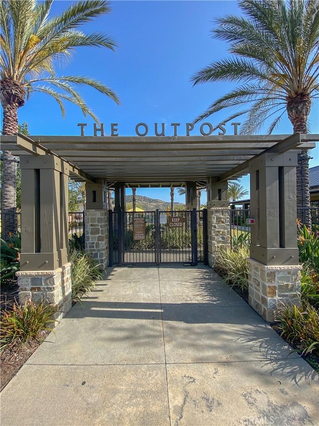 5 Abarrota St, Rancho Mission Viejo, CA 92694 - view of vehicle parking with a gate and concrete driveway