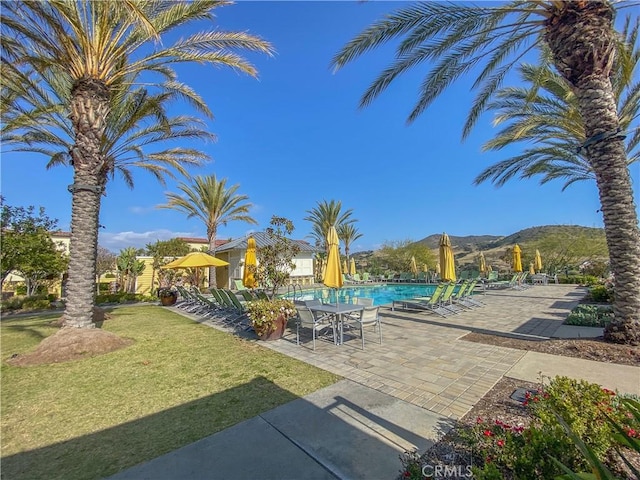 5 Abarrota St, Rancho Mission Viejo, CA 92694 - view of grassy yard with a community pool and a patio area