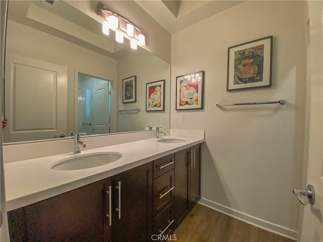 5 Abarrota St, Rancho Mission Viejo, CA 92694 - full bathroom featuring double vanity, wood finished floors, and baseboards