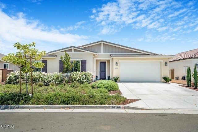 30106 Stargazer Way, Menifee, CA 92584 - single story home with concrete driveway, an attached garage, and stucco siding