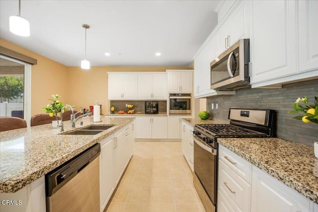 30106 Stargazer Way, Menifee, CA 92584 - kitchen featuring appliances with stainless steel finishes, a sink, white cabinetry, backsplash, and recessed lighting