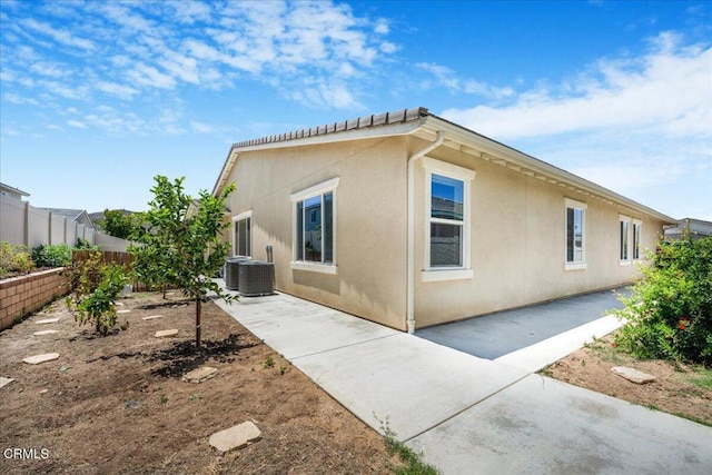 30106 Stargazer Way, Menifee, CA 92584 - view of property exterior featuring a fenced backyard, a patio, stucco siding, and cooling unit