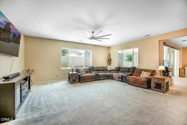 30106 Stargazer Way, Menifee, CA 92584 - carpeted living area with plenty of natural light, a ceiling fan, and baseboards