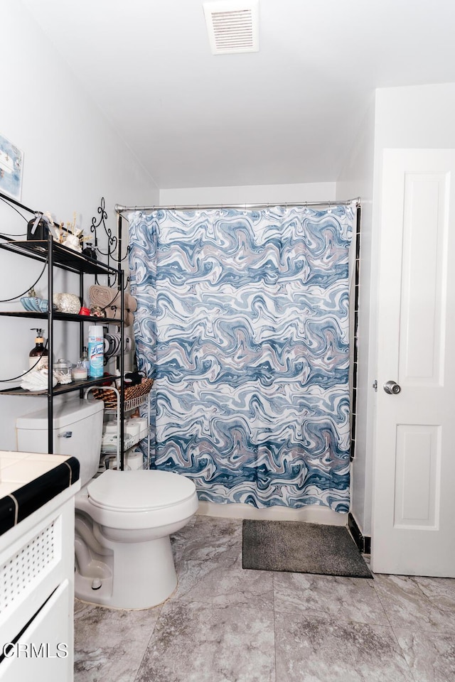 153 E Date St, Oxnard, CA 93033 - bathroom featuring toilet, vanity, and curtained shower