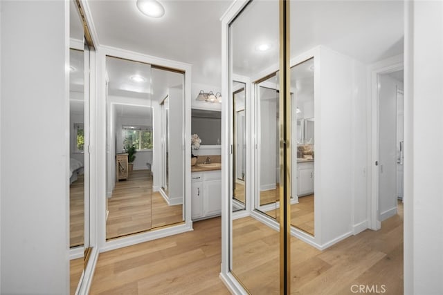 13400 Del Monte Unit 1M, Seal Beach, CA 90740 - walk in closet featuring light wood-style floors and a sink