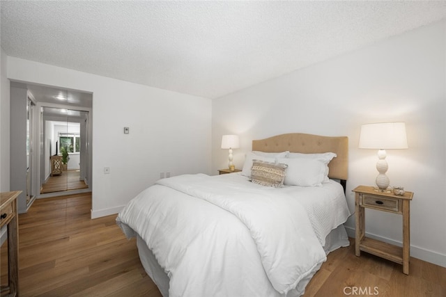 13400 Del Monte Unit 1M, Seal Beach, CA 90740 - bedroom featuring wood finished floors and baseboards