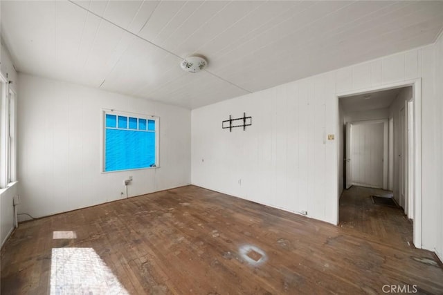 1427 Beach St, San Luis Obispo, CA 93401 - empty room with hardwood / wood-style floors and wooden walls