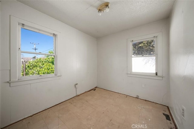 1427 Beach St, San Luis Obispo, CA 93401 - unfurnished room featuring light floors and a textured ceiling