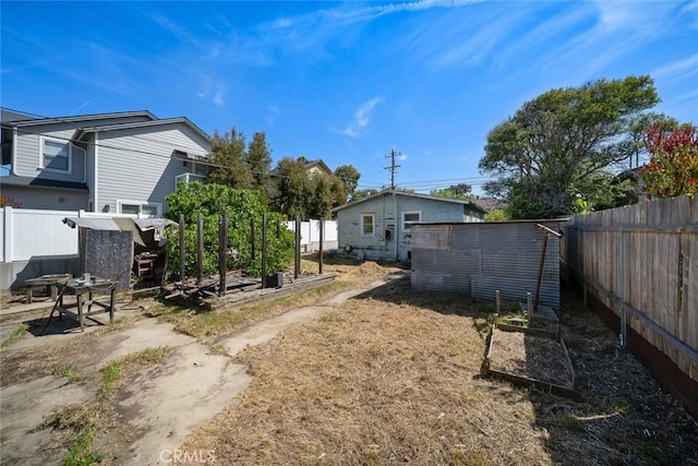 1427 Beach St, San Luis Obispo, CA 93401 - fenced backyard with a vegetable garden