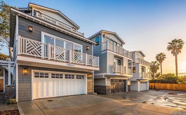 8014 La Jolla Shores Dr, La Jolla, CA 92037 - view of front facade featuring concrete driveway, a garage, and a balcony