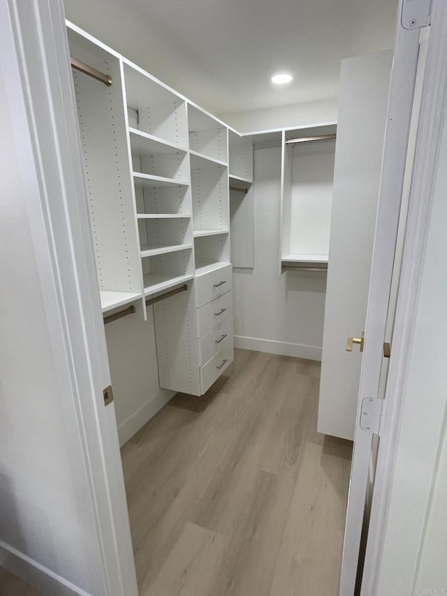 6745 Mewall Dr, San Diego, CA 92119 - walk in closet featuring light wood-type flooring