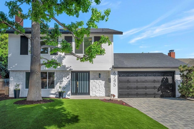 6745 Mewall Dr, San Diego, CA 92119 - view of front of home with a garage, stone siding, a front lawn, driveway, and a chimney
